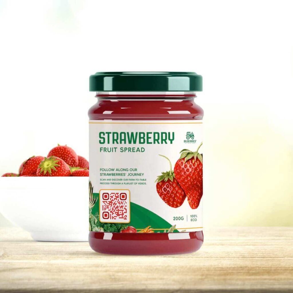 A QR Code on a jar of jam with text inviting the user to scan for more information.