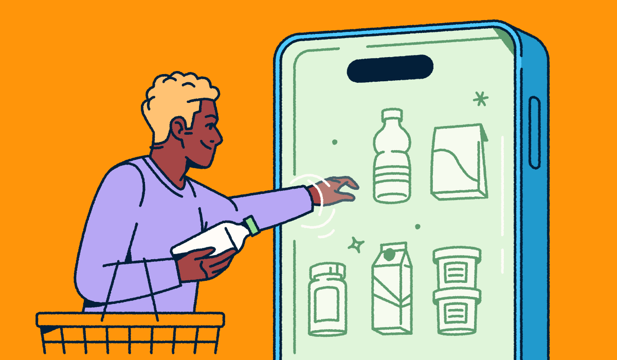 A person holding a shopping basket and selecting consumer packaged goods from a mobile "fridge."