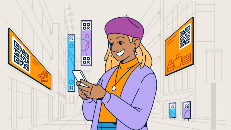 A woman standing in a city with digital advertisements featuring QR Codes around her. She's holding a smartphone in her hands.